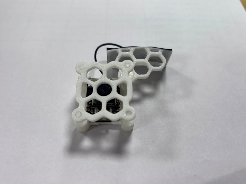 3D-printed honeycomb camera housing holding the ESP32-S3 and OV2640 camera module